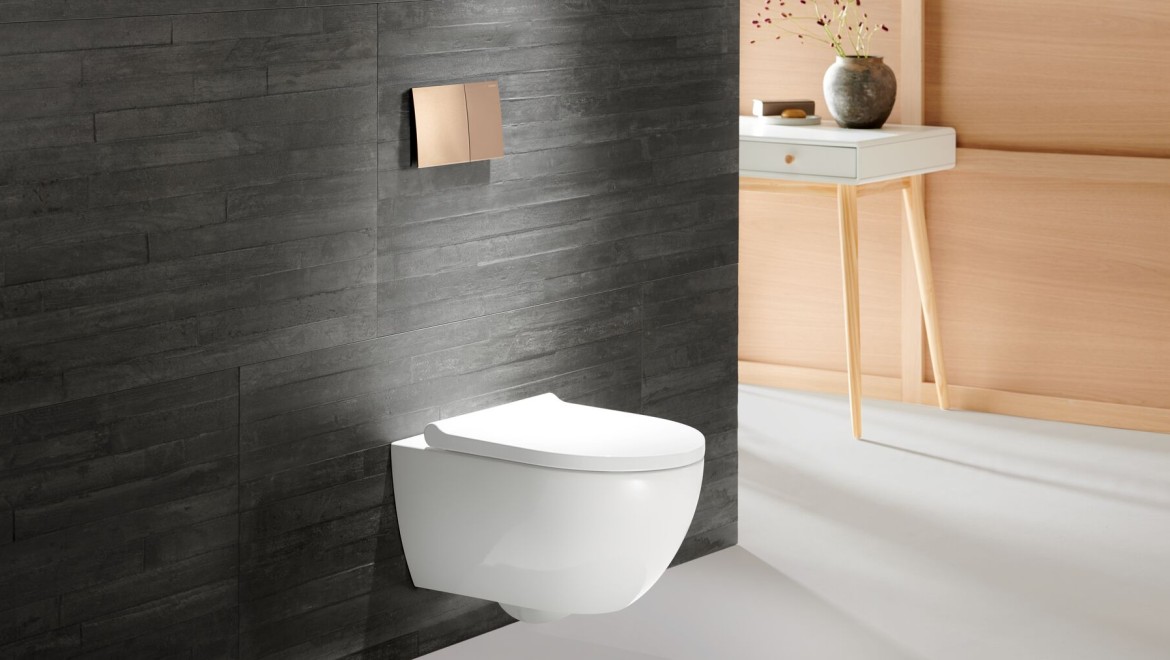 Vasul WC Geberit Acanto cu clapetă de acţionare Geberit Sigma70 de culoare aur roz Vasul WC Geberit Acanto cu clapetă de acţionare Geberit Sigma70 de culoare aur roz